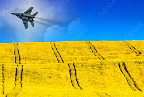 Collage of russian air fighter and Ukraine flag photo