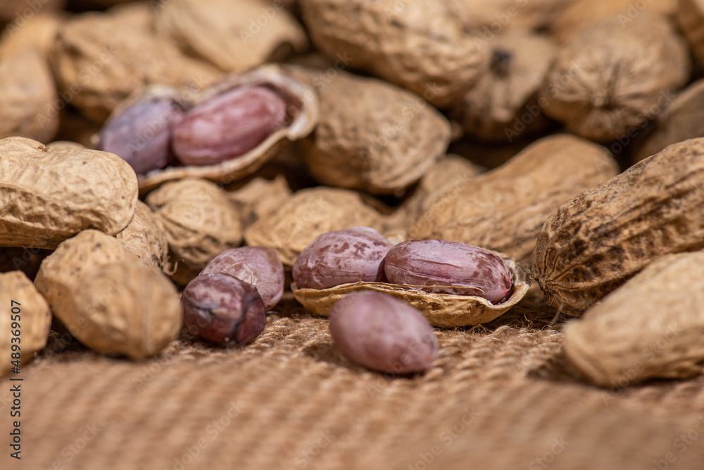The peeled peanuts are placed among many peanuts The peeled peanuts are placed among many peanuts