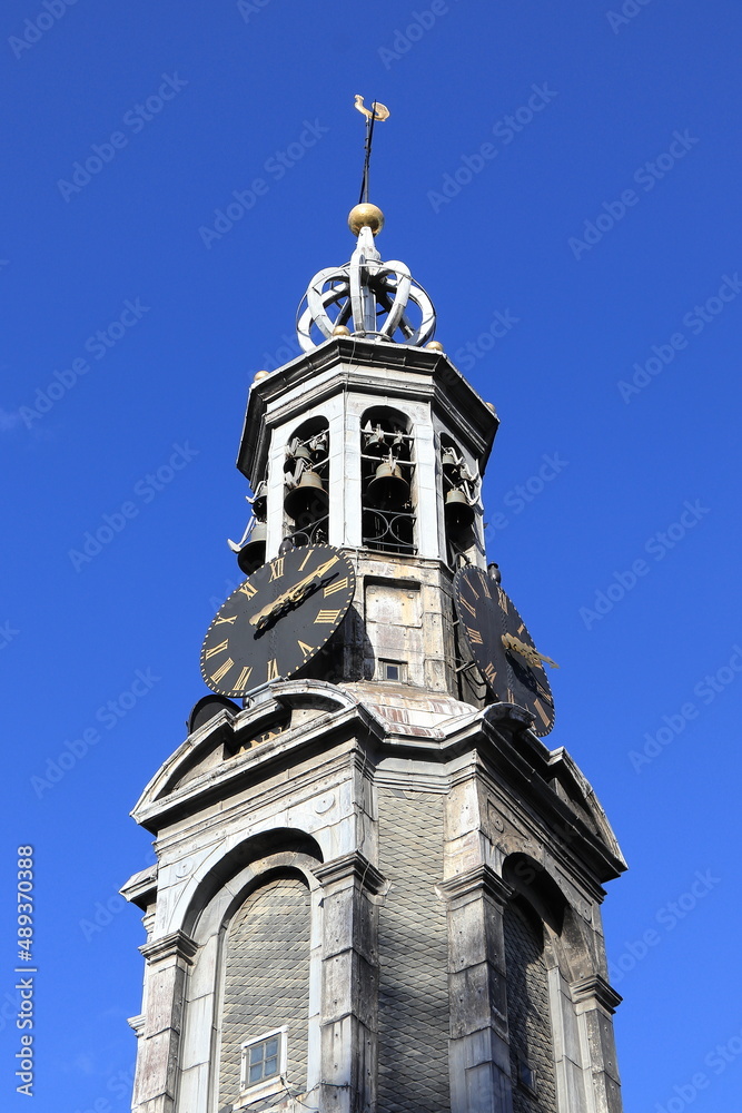 Amsterdam Munt Tower Close Up against a Bright Blue Sky, Netherlands Amsterdam Munt Tower Close Up against a Bright Blue Sky, Netherlands