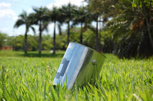 Paint can pinhole camera on the lawn of the park. photographing outdoors. Old photography. pin hole. Pinhole concept.