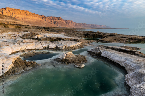 Colorful salt pools formed by erosion and evaporation on the shoreline of Israel's Dead Sea, the lowest point on earth.