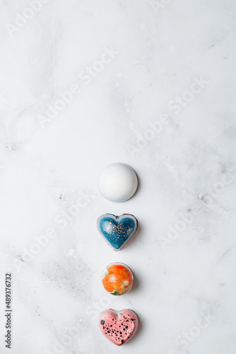 Creative handmade chocolates. Stylish set of sweets on a white background view from above