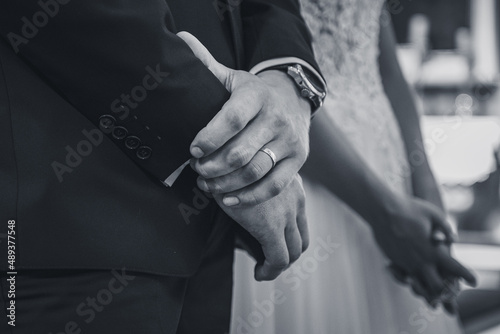 hands of the groom during wedding ritual