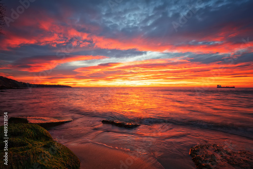 Amazing red sunrise over the sea.. © EdVal