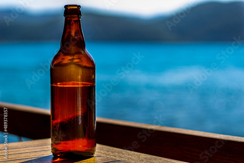 Beer bottle by the beach