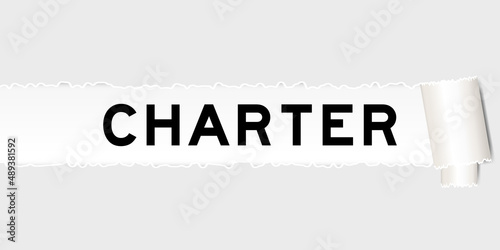 Ripped gray paper background that have word charter under torn part