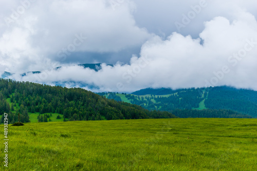 A picturesque landscape view of the French Alps mountains on a cloudy summer day (Valberg, Alpes-Maritimes, France)