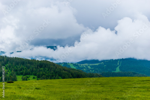A picturesque landscape view of the French Alps mountains on a cloudy summer day (Valberg, Alpes-Maritimes, France)