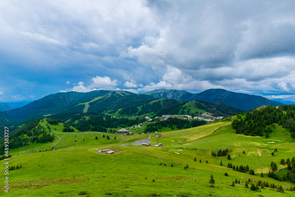 A picturesque landscape view of the French Alps mountains on a cloudy summer day (Valberg, Alpes-Maritimes, France)