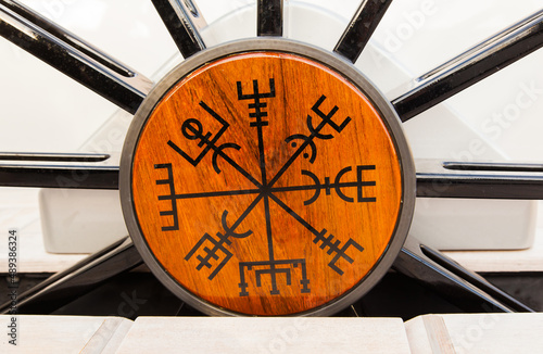 Unusual scandinavian symbols and signs on the helm of a sailing yacht. Viking runes on a sailing yacht.