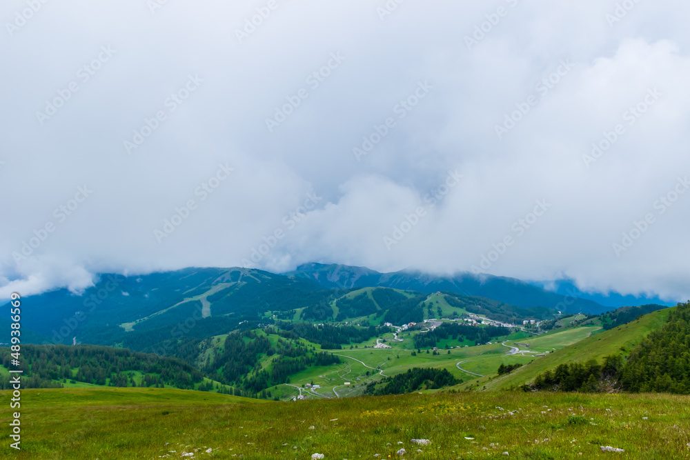 A picturesque landscape view of the French Alps mountains on a cloudy summer day (Valberg, Alpes-Maritimes, France) A picturesque landscape view of the French Alps mountains on a cloudy summer day (Valberg, Alpes-Maritimes, France)