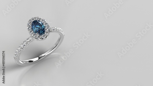 silver or platinum engagement ring with blue white gemstone