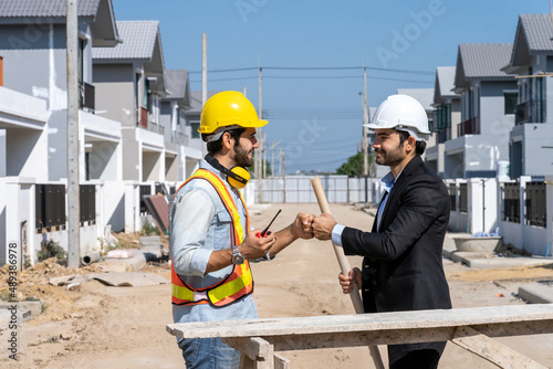 Businessman and architect shake hand success at construction site,Partnership,Teamwork,Community,Connection industrial and investment concept.