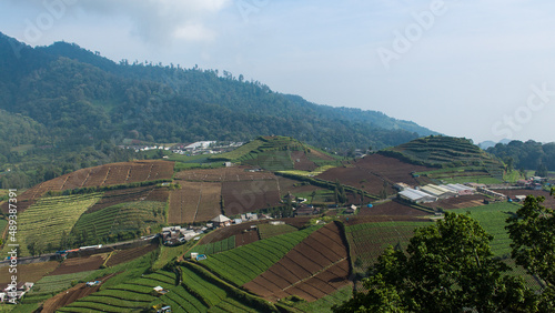 East Java, Indonesia - February 10, 2022 : An amazing view of terraces village in Cangar city, Malang, East Java.