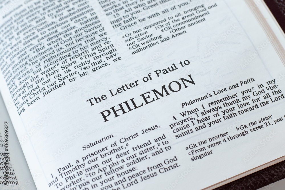 Philemon open Holy Bible Book close-up. New Testament Scripture. Studying the Word of God Jesus Christ. Christian biblical concept of faith and trust. Philemon open Holy Bible Book close-up. New Testament Scripture. Studying the Word of God Jesus Christ. Christian biblical concept of faith and trust.