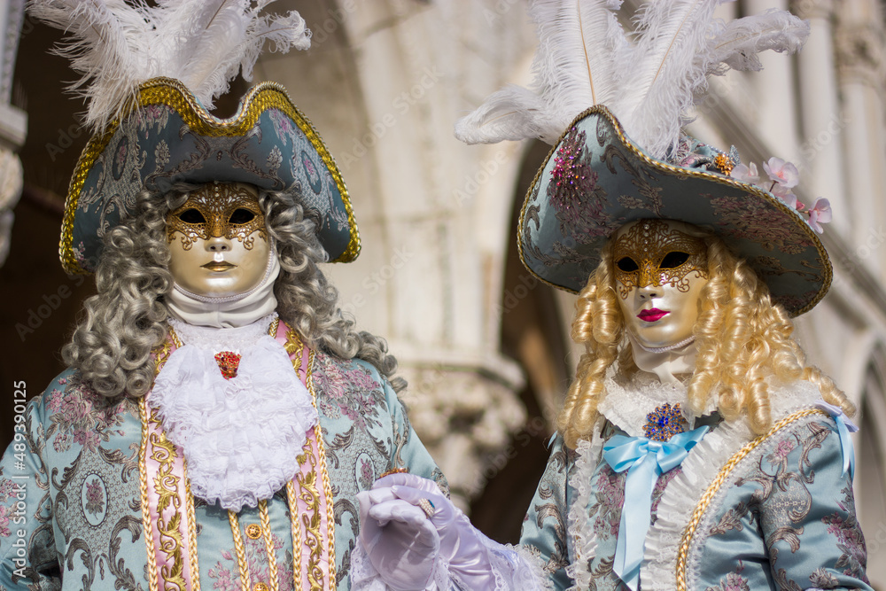 period costumes in front of the basilica of San Marco for the Venice Carnival