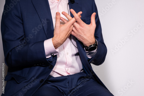 Successful businessman gestures with his hands, holds a business conference