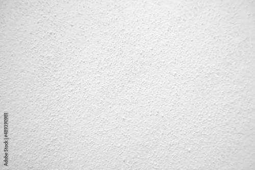 Seamless texture of white cement wall a rough surface, with space for text, for a background