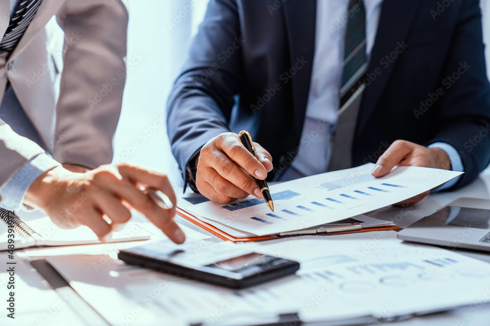 Business team working on new startup projects. Discuss the analysis of charts and graphs showing investment performance reports. and profit accounting and finance business ideas Business team working on new startup projects. Discuss the analysis of charts and graphs showing investment performance reports. and profit accounting and finance business ideas