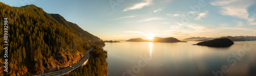 Aerial Panoramic View of Sea to Sky Highway on Pacific Ocean West Coast. Sunny Winter Colorful Sunset. Located in Howe Sound between Vancouver and Squamish  British Columbia  Canada.