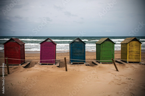 Colored booths on the beach © Nacho