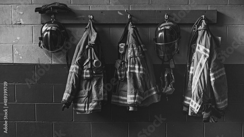 Firefighter helmet and protection coat hanging in the fire station
