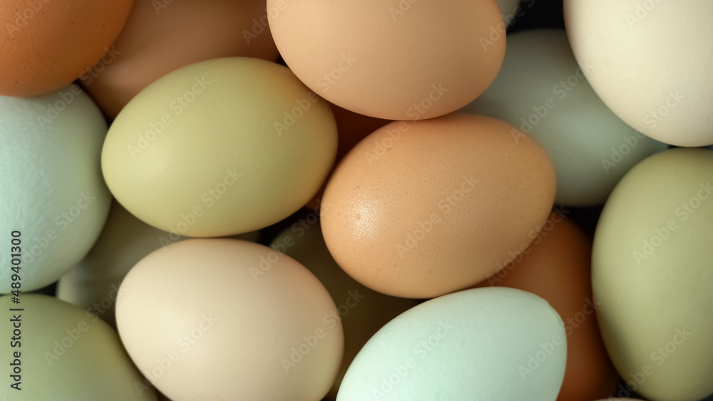 Top view of colored fresh raw chicken eggs. Natural farm food. Top view of colored fresh raw chicken eggs. Natural farm food.