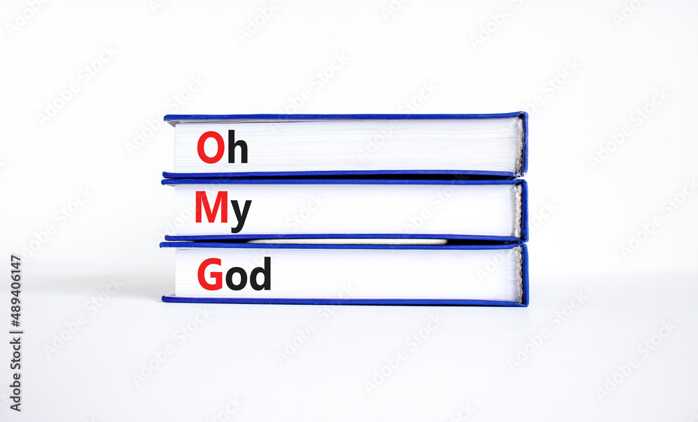 OMG oh my god symbol. Concept words OMG oh my god on books on a beautiful white table, white background. Business and OMG oh my god concept. Copy space. OMG oh my god symbol. Concept words OMG oh my god on books on a beautiful white table, white background. Business and OMG oh my god concept. Copy space.