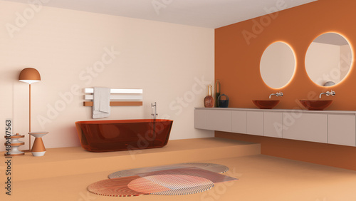 Showcase bathroom interior design in orange and beige tones, glass freestanding bathtub and wash basing. Round mirrors, faucets, modern carpet, floor lamp, tables. Minimalist project