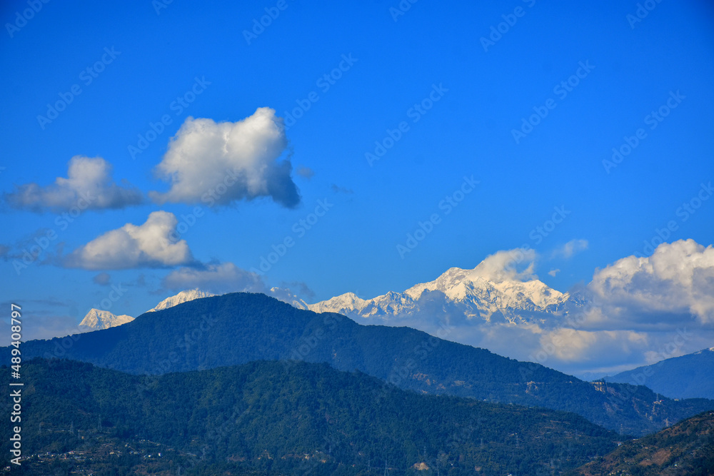 Mountain ridges in the clouds with Mt. Kanchanjunga range