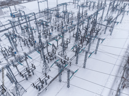 Aerial view of a high voltage electrical substation in winter season.
