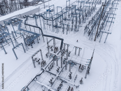 Aerial view of a high voltage electrical substation in winter season.