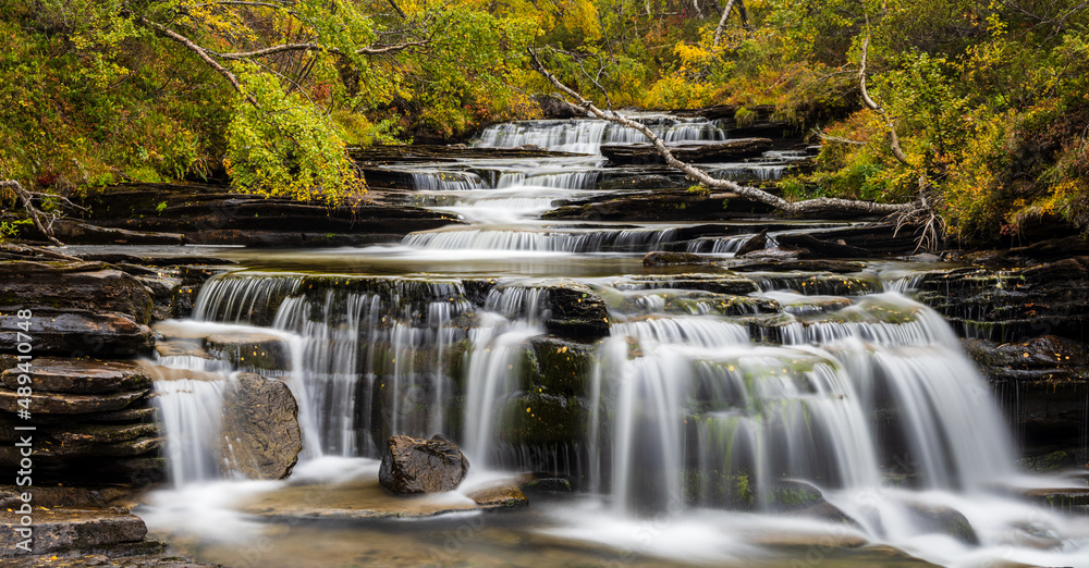 Obraz premium Waterfall in autumn forest, Sweden