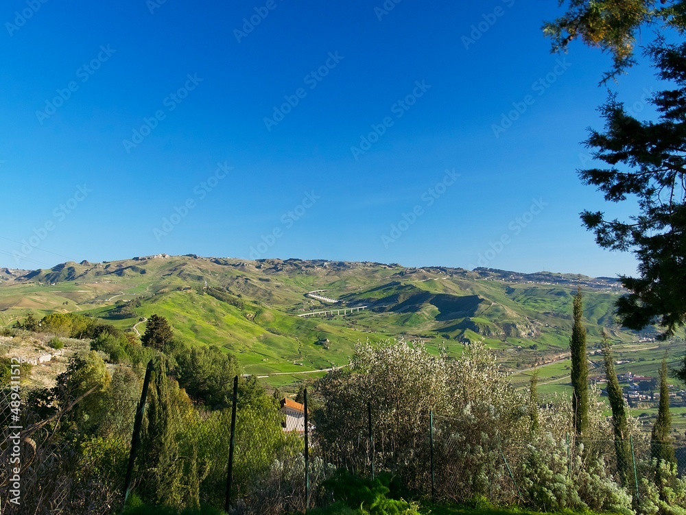 a picturesque landscape of green hills in San Giovanni Gemini on a sunny February day. Sicily, Italy