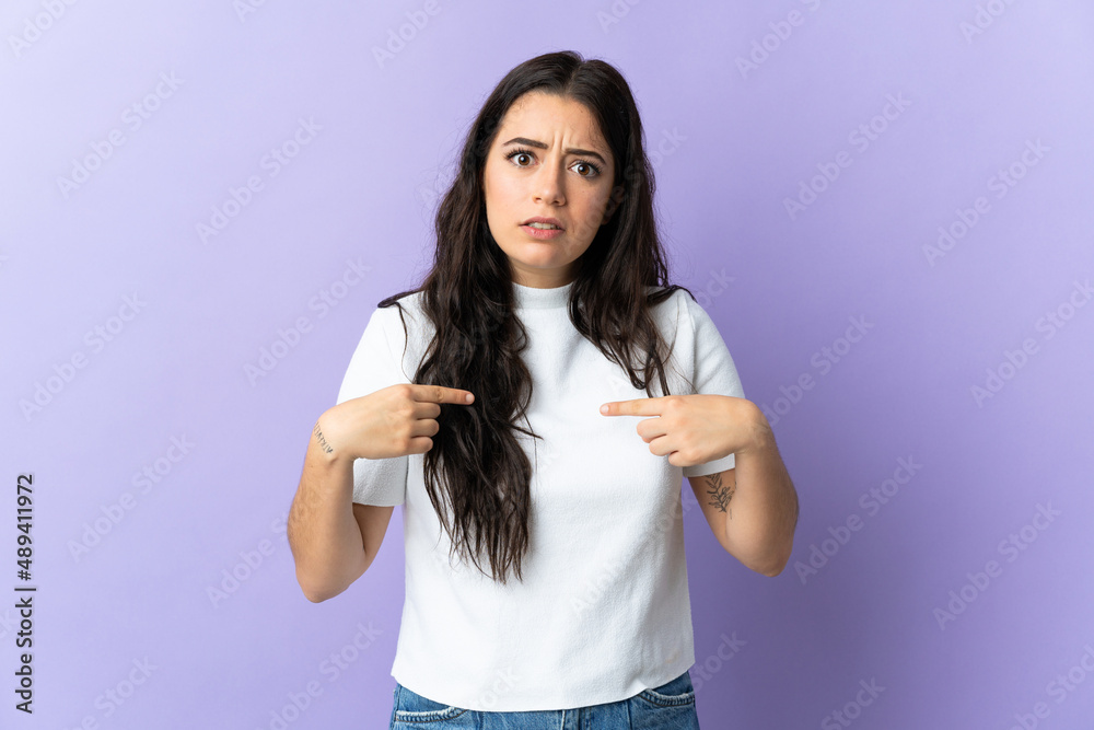 Young caucasian woman isolated on purple background pointing to oneself Young caucasian woman isolated on purple background pointing to oneself