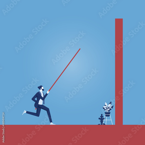 Business overcome challenge and obstacle concept, businessman doing pole vaulting to over wall