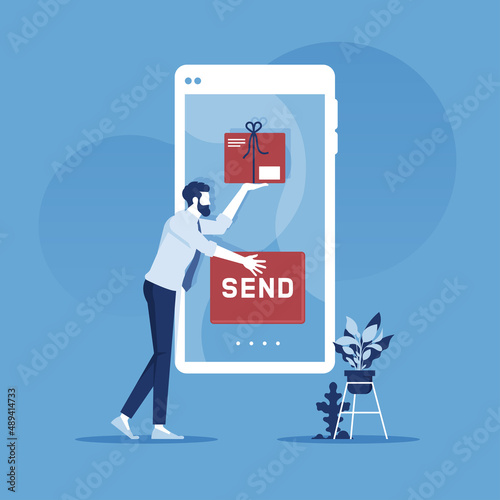 Send goods, purchase, order package from online store to the customer via smartphone. E-commerce office employee puts a box in the phone screen