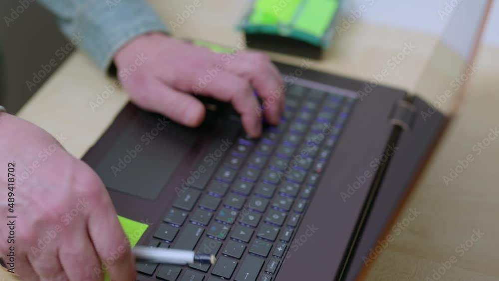 Close up view of man typing on computer keyboard. Sweden. Close up view of man typing on computer keyboard. Sweden.