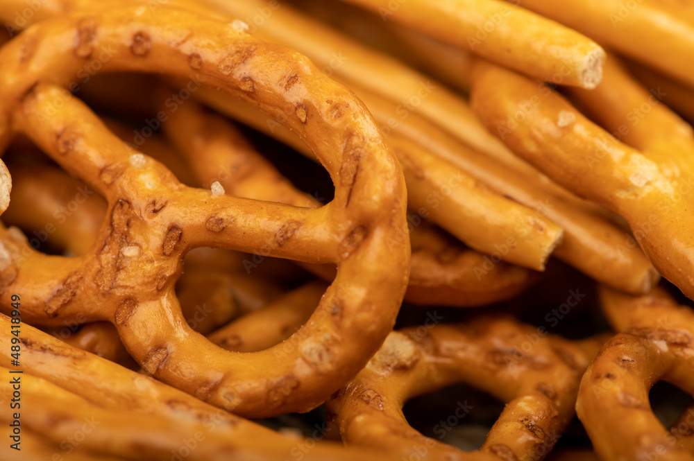 Crispy bread straws with salt, close-up, selective focus, top view. Crispy bread straws with salt, close-up, selective focus, top view.