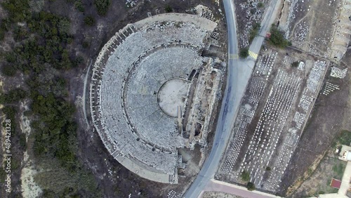 Top down aerial view of Perge Ancient City Amphitheater - Drone shot panning and descending
