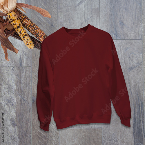 Mockup sweatshirt garnet with Indian corn still life with room for text copyspace for your graphics or text in this casual fashion.