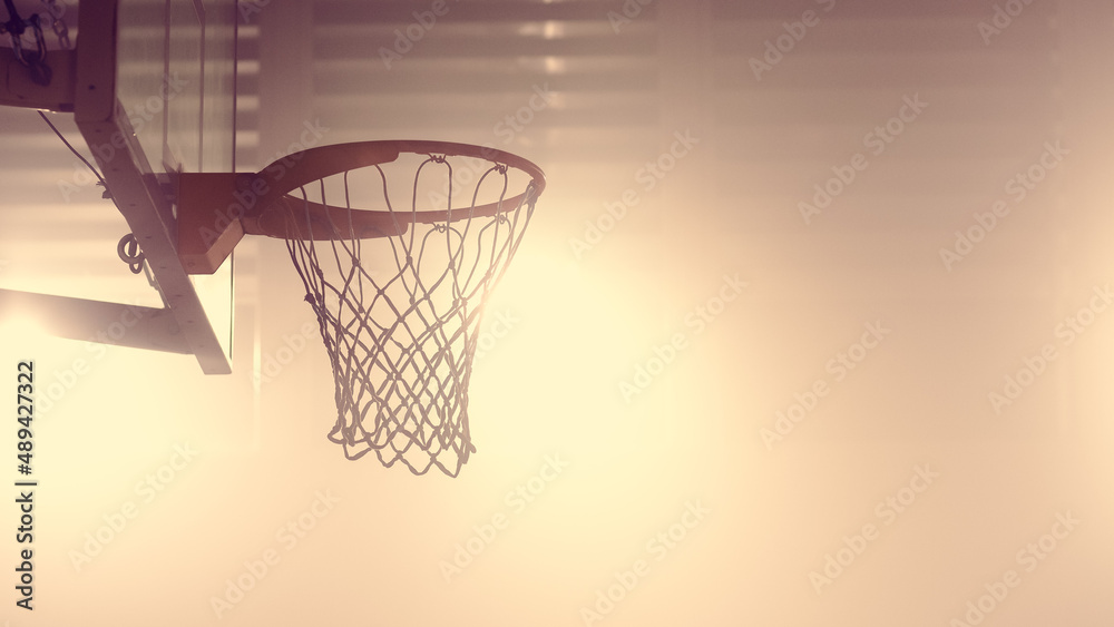 Close-up Shot of a Basketball Net of an Indoor Basketball Court. Shot with Warm Colors.