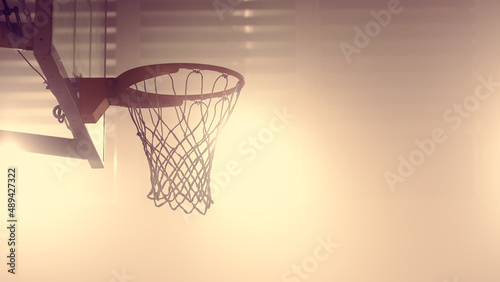 Close-up Shot of a Basketball Net of an Indoor Basketball Court. Shot with Warm Colors. photo