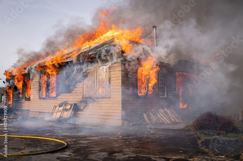 A two-story house fully engulfed structure fire