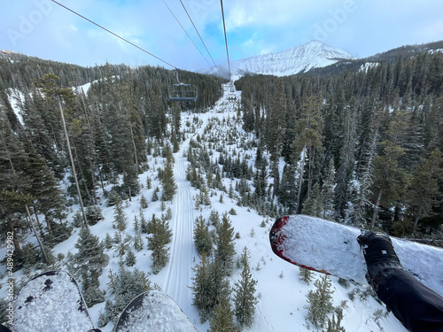 Scenic view of chairlift and snow covered slopes at Big Sky Ski Resort in Montana on a sunny winter day