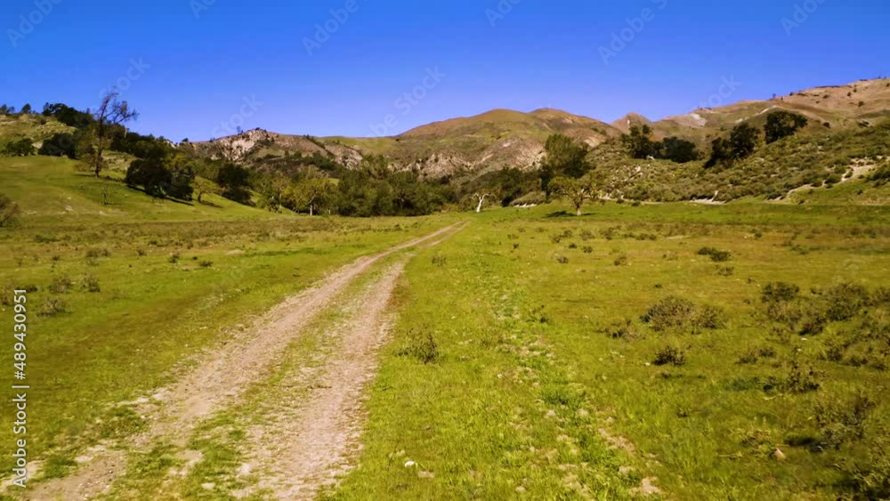 A collection of drone shots revealing incredible natural California landscapes, featuring vast lush views of green rolling hills, oak trees, and beautiful ranch land. A collection of drone shots revealing incredible natural California landscapes, featuring vast lush views of green rolling hills, oak trees, and beautiful ranch land.