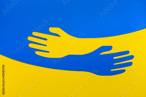 Support for Ukraine. Embrace icon, arms hugging, War in Ukraine, attack from Russia. Papercut, hands hug linear vector logo template. Care, love and charity symbol, hand drawn vector illustration photo