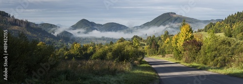 Morning in Mala Fatra. Sunrise, fog, mountains, road. Slovakia. photo
