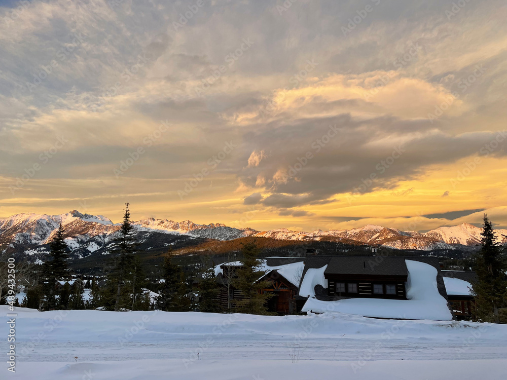 Golden sunset skies over Gallatin Peak as seen from Big Sky, Montana on a winter day Golden sunset skies over Gallatin Peak as seen from Big Sky, Montana on a winter day