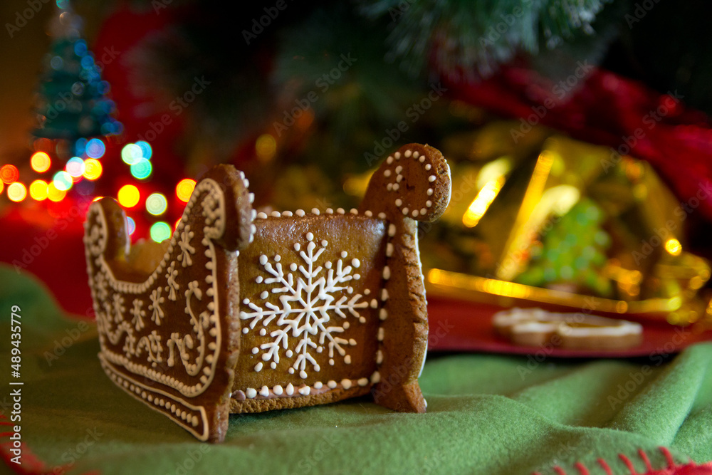 Gingerbread on a New Year's background. New Year's gingerbread with a bokeh light garland.